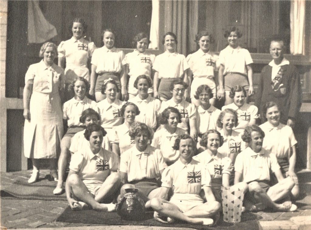 In June two teams of lady gymnasts totalling twenty one travel to Ostend for the Belgium Festival. One team represents the north and the other the south of England. Various items are in the programme; 5 apparatus for the individual competition, team exercise in rhythmic exercise, national dances, and fancy dress. Mrs Carrie Pollard, North and Mr Bill King South are the two instructors.